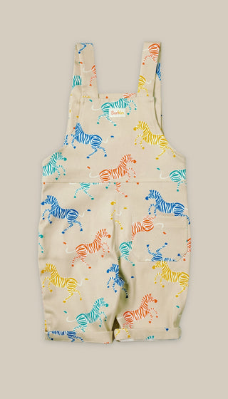 Back of children's overalls with colorful zebra pattern on a beige background