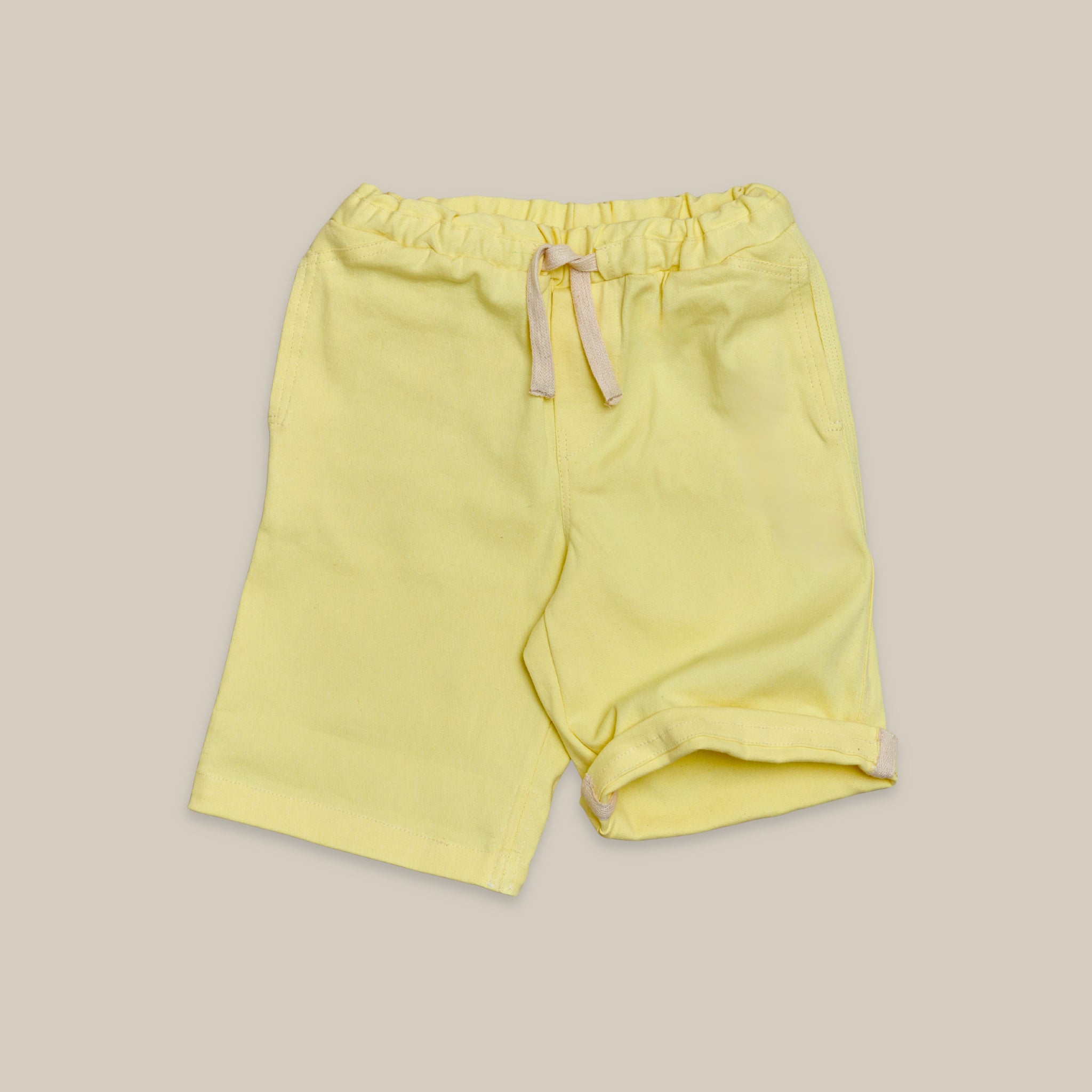 Front view of kids shorts with drawstring, side pockets and back pocket
