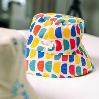 Colorful bucket hat with geometric pattern on a blurred foreground