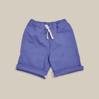 Violet kids shorts with a drawstring on a beige background