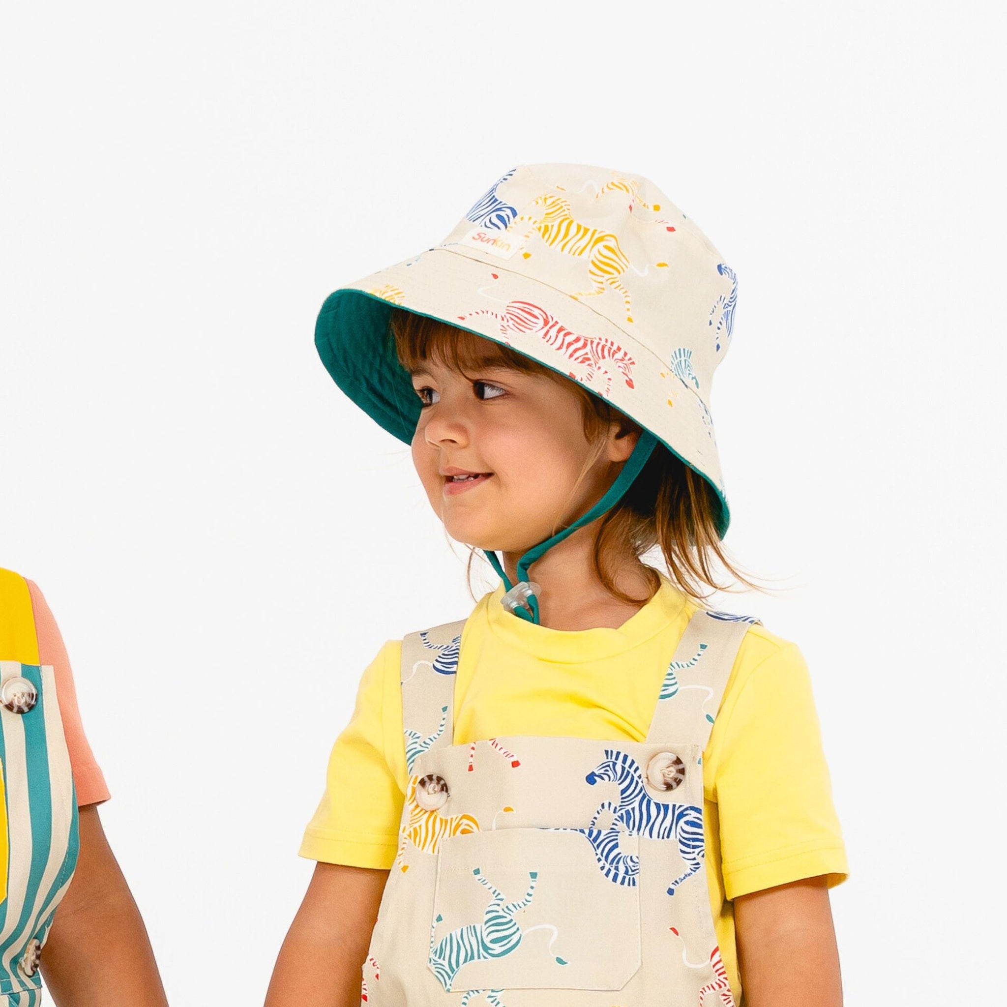 Toddler wearing sun safe hat by SunKin and matching shortarees