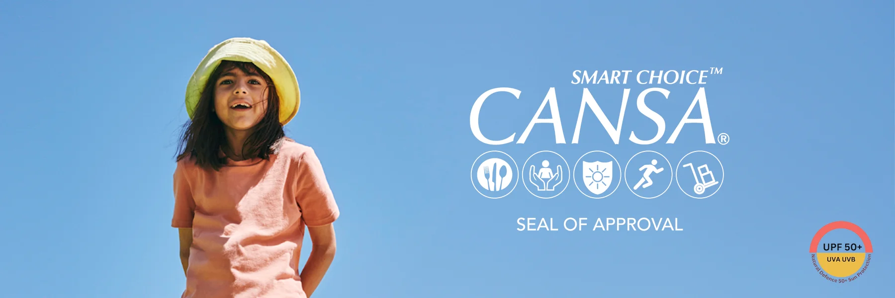 Child in UPF50+ SunKin clothing and wide-brim hat standing outdoors under blue sky with CANSA seal of approval displayed