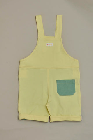 Back view of SunKin’s multicolour shortaree—sun-safe cotton dungarees with playful colour blocking and relaxed fit.