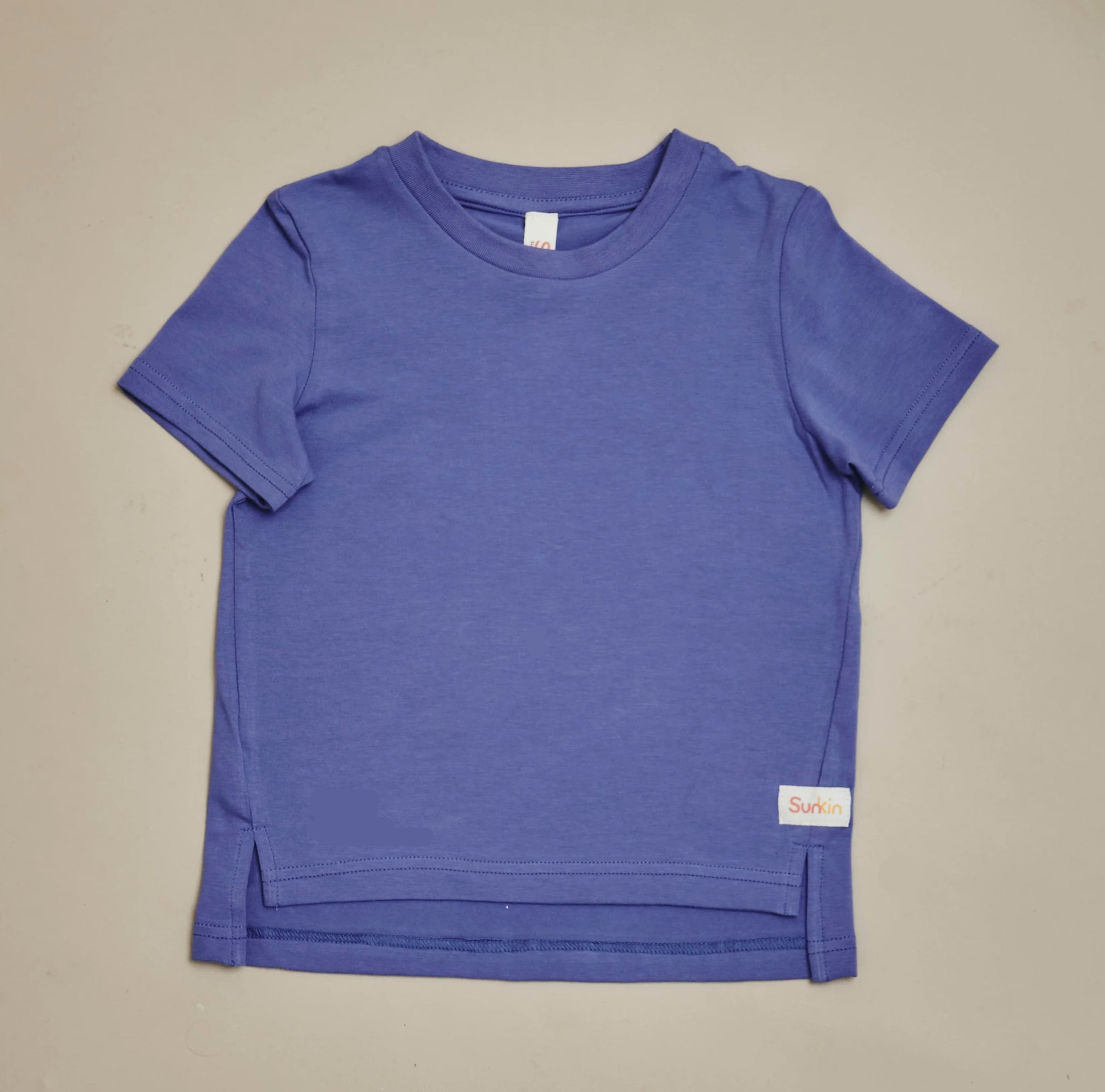 Violet UPF50+ kids t-shirt with dropped hem and side slits—sun-safe, breathable cotton from SunKin.