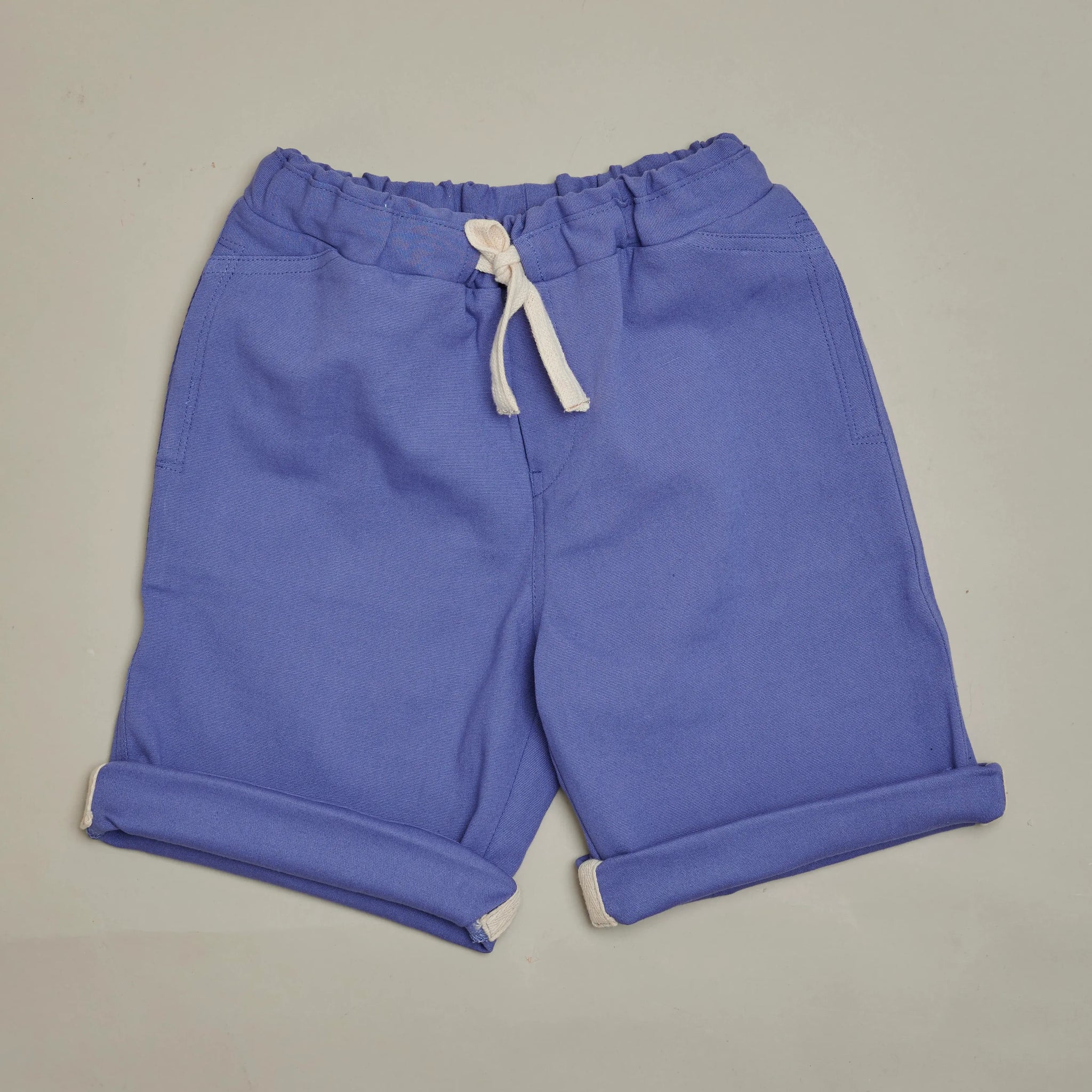 Front view of SunKin’s Violet UPF50+ woven shorts—sun-safe, breathable cotton with drawstring waist and side pockets.