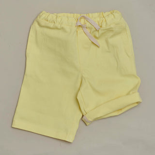 Front view of SunKin’s Yellow UPF50+ woven shorts—lightweight cotton with elasticated waistband, drawstring, and side pockets.