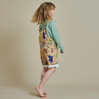 Child in SunKin’s UPF50+ Tiger Print Shortaree and green long sleeve tee—playful and sun-safe style for everyday outdoor adventures.