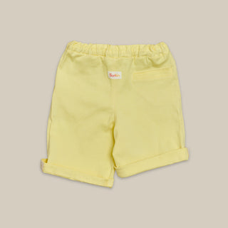 Back view of kids yellow shorts in twill