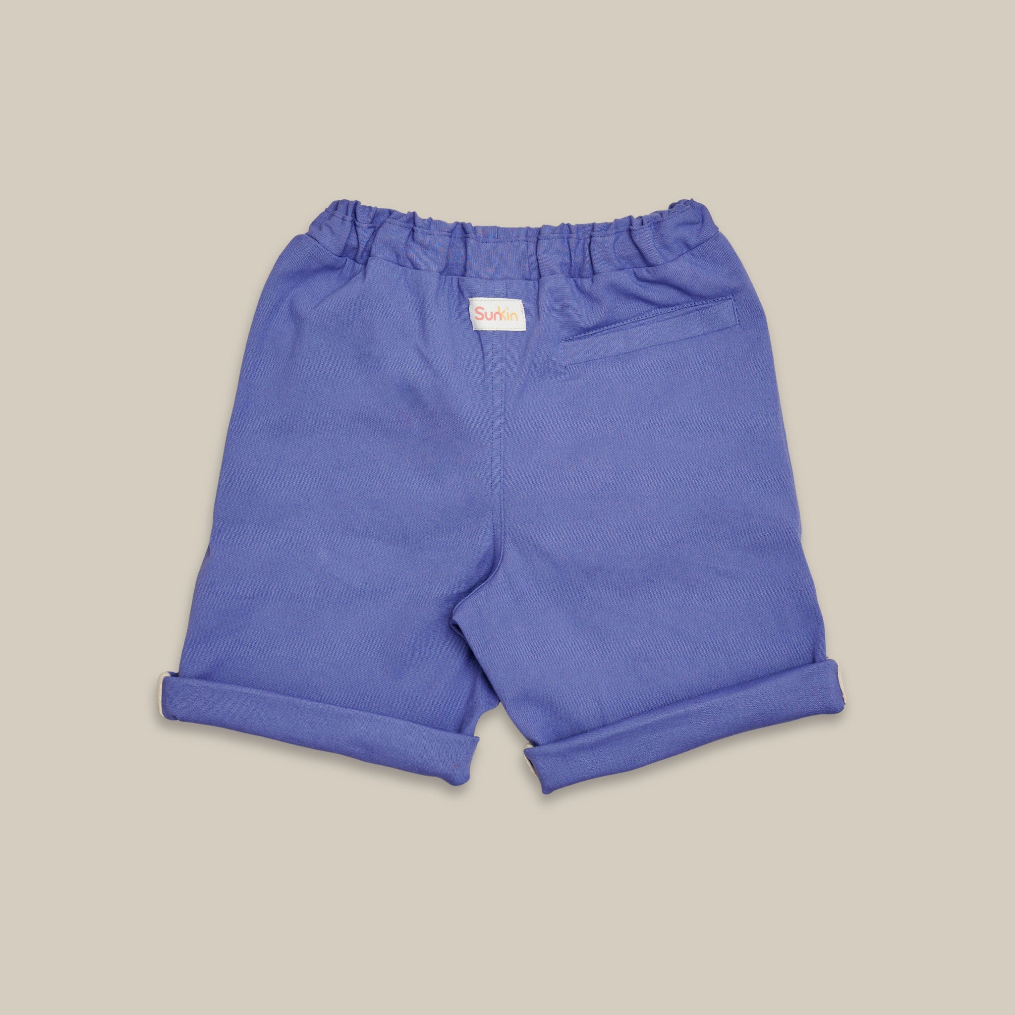 Violet shorts on a beige background