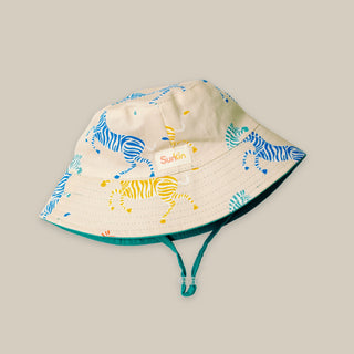 Children's sun hat with zebra pattern on a beige background